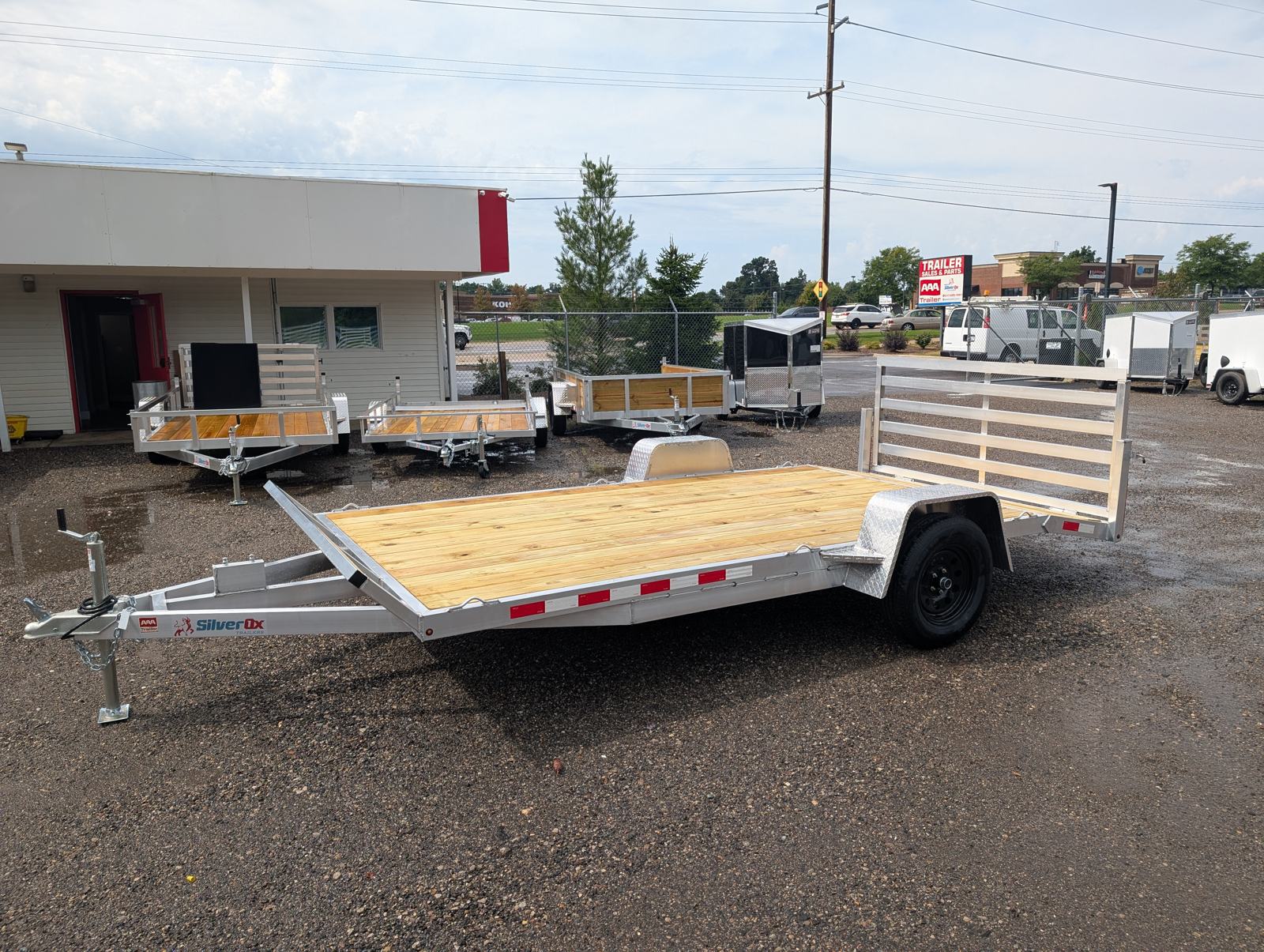 Silver Ox 7x14 Oxtail Sport aluminum utility trailer — three-quarter view with the rear gate up