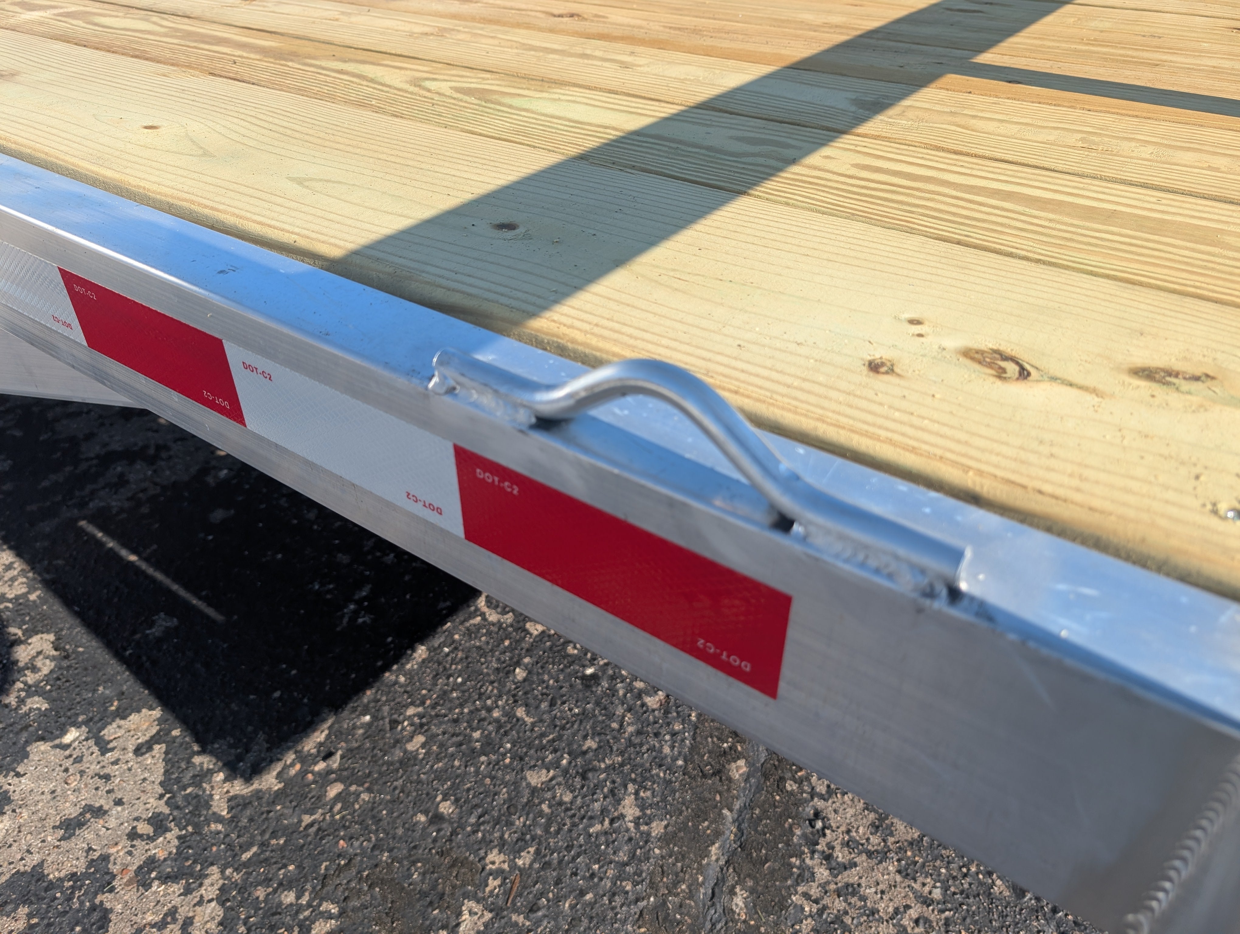 Silver Ox utility trailer welded D-ring tie-down hoop rail detail