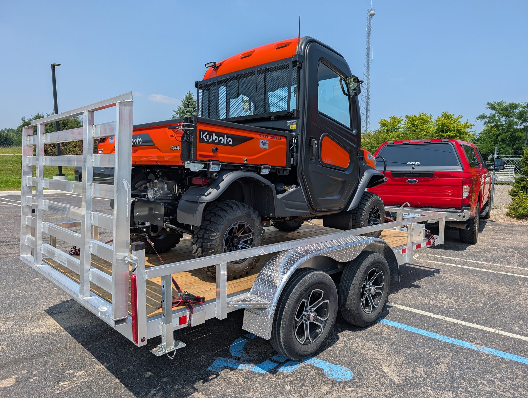 Silver Ox 7x16 aluminum utility trailer rear view with Kubota diesel